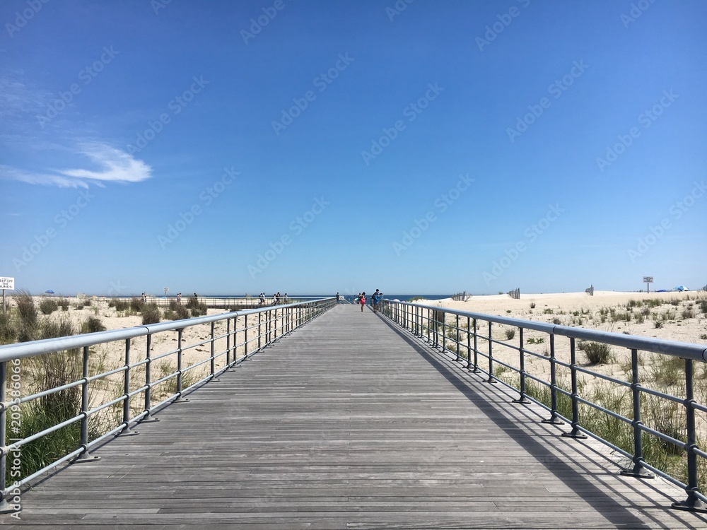 A boardwalk leading to the beach at Robert Moses State Park on Fire Island, New York
