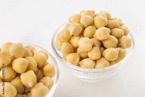 Chickpea grains (Cicer arietinum) in bowl isolated on white background