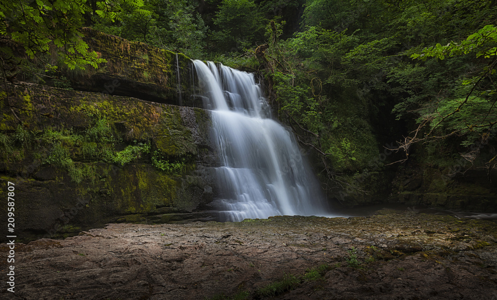 The Sgwd Clun Gwyn waterfall, a huge ledged waterfall on the Mellte river, near the village of Pontneddfechan in South Wales, UK.
