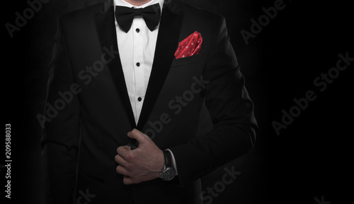 Young handsome man in black suit.