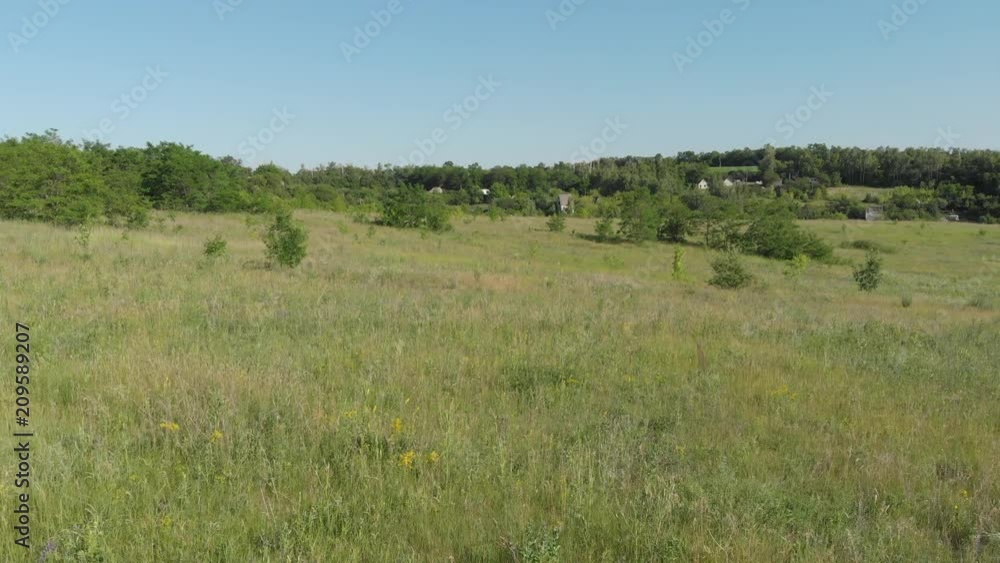 Aerial photography 4k. View of the dirt road in summer in the field. Aerial photography 4k. View of the dirt road in summer in the field.