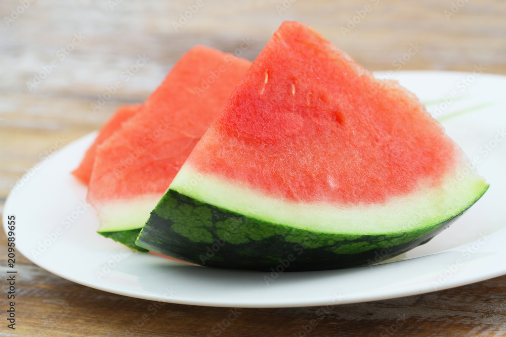 Two slices of freshly cut watermelon, closeup
Two slices of freshly cut watermelon, closeup