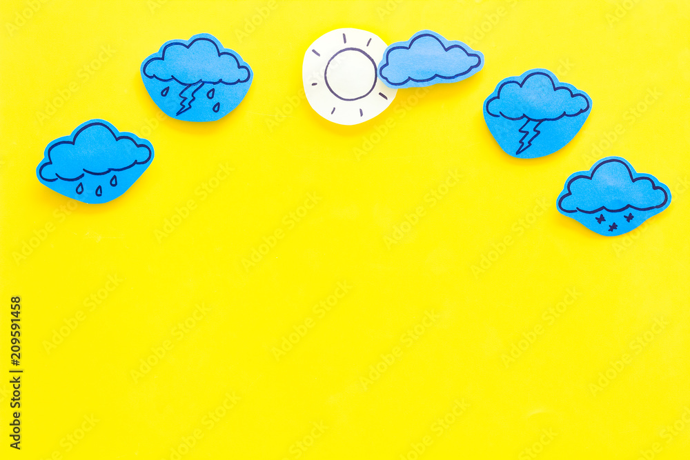 Modern weather icons set on yellow background top view copy space - obrazy, fototapety, plakaty 