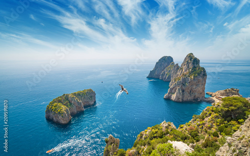 Famous Faraglioni rocks, Capri island, Italy photo