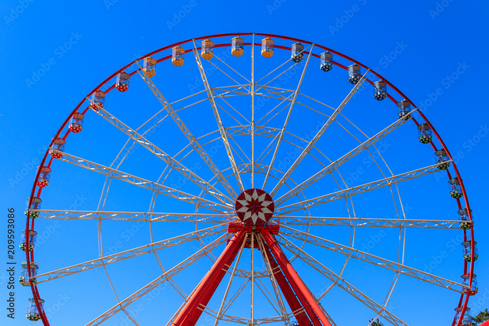 Ferris wheel on background of blue sky in Gorky Park. Kharkov, Ukraine Ferris wheel on background of blue sky in Gorky Park. Kharkov, Ukraine