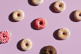 Colorful Donuts On Purple Background In Summer