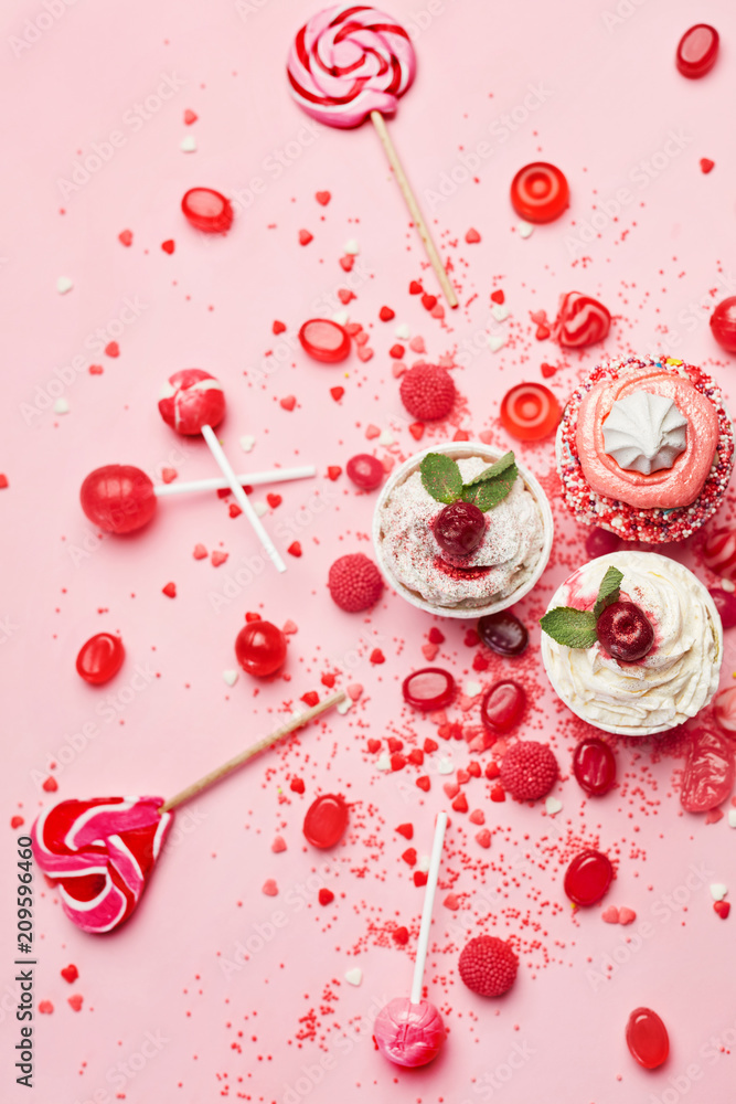 Sweets. Candy And Cupcakes On Pink Background Sweets. Candy And Cupcakes On Pink Background