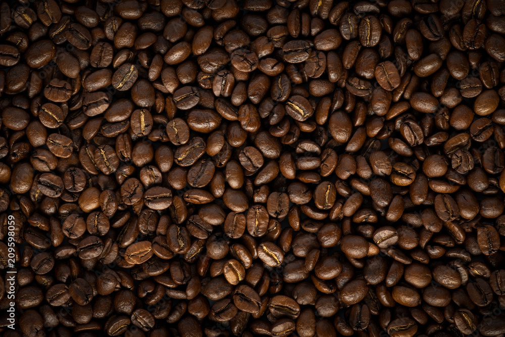 Background with roasted coffee beans. top view with space for text