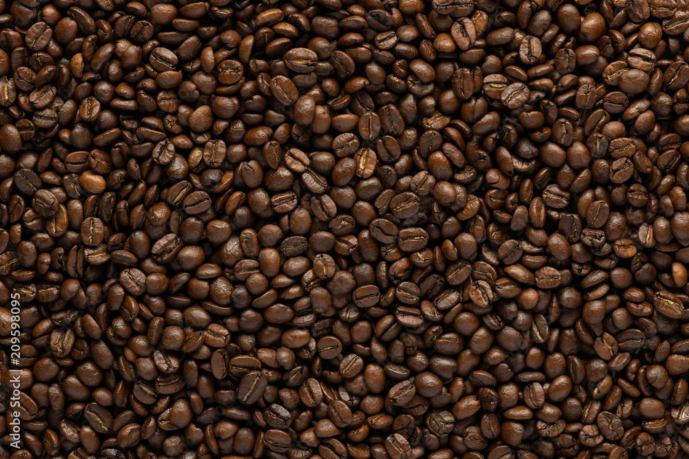 Background with roasted coffee beans. top view with space for text