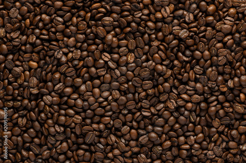 Background with roasted coffee beans. top view with space for text