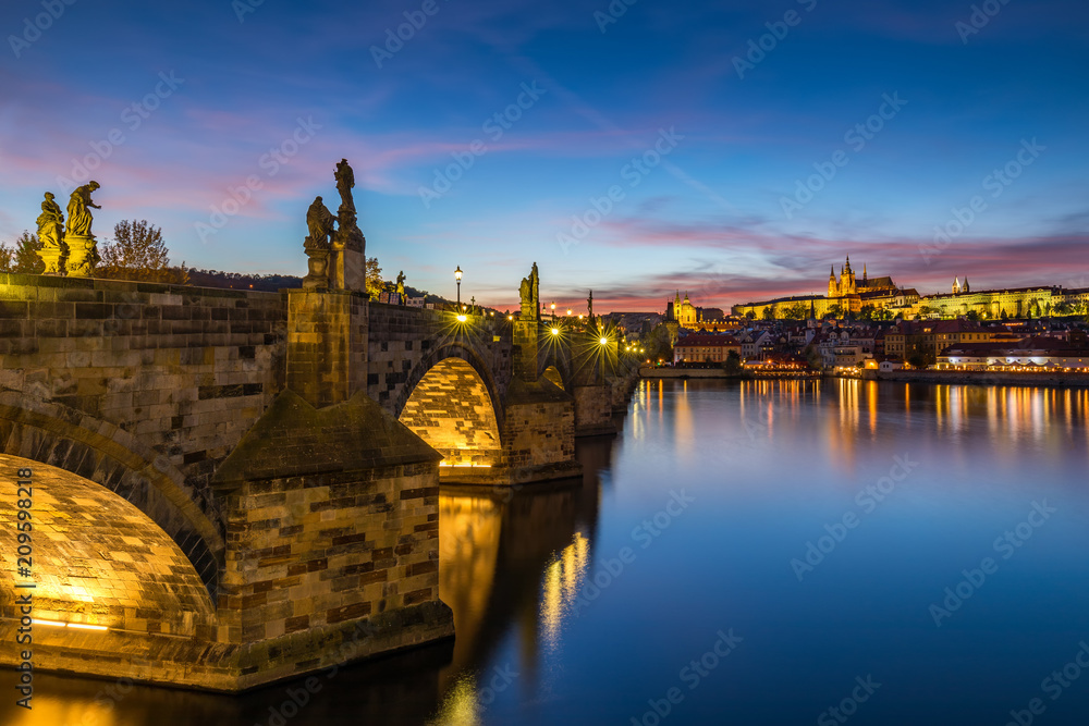 Famous Charles bridge in the sunset light, beautiful scenary and one of the iconic landmarks in Prague. Czech Republic.