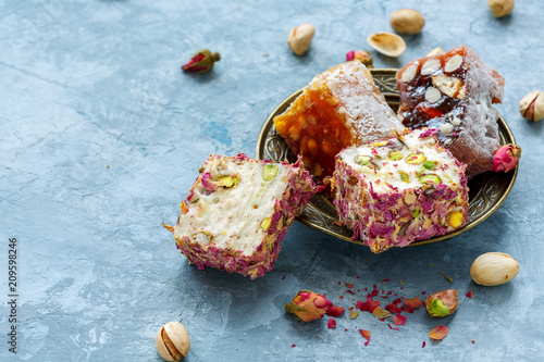 Turkish delight with pistachios, pink petals and almonds.