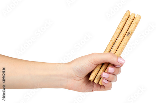 Crispy cookies with chocolate fill with hand isolated on a white background