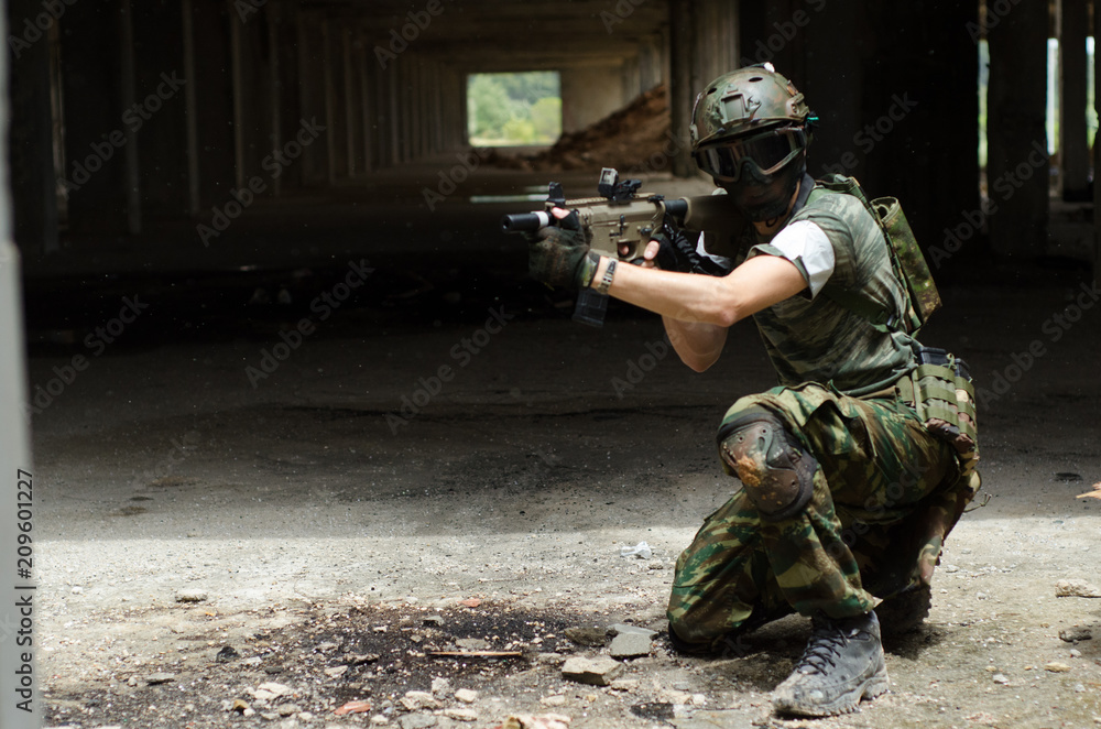 Fototapeta premium Kneeling unsupported firing position