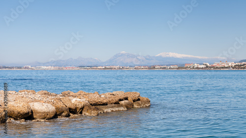 Fototapeta Naklejka Na Ścianę i Meble -  Side West Beach.  The view towards the west beach of Side taken from the peninsula of the ancient Greek city of Side in southern Turkey.