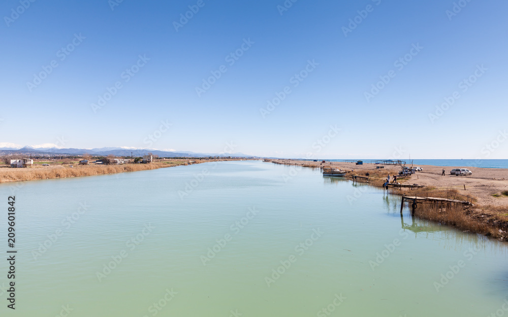 The view looking down Manavgat River towards the Mediterranean Sea in the province of Antalya, southern Turkey. The view looking down Manavgat River towards the Mediterranean Sea in the province of Antalya, southern Turkey.