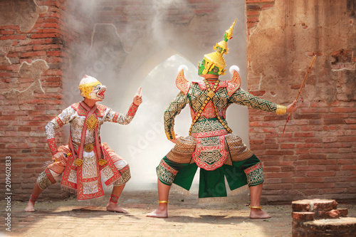 Obraz na plátně Hanuman (monkey god) fighting Thotsakan (giant) in Khon or Traditional Thai Pantomime as a cultural dancing arts performance in mask dressed based on the character in Ramakien or Ramayana Literature