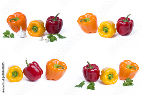 Red yellow and orange peppers on a white background..Multicolored vegetables in a composition on an abel background.