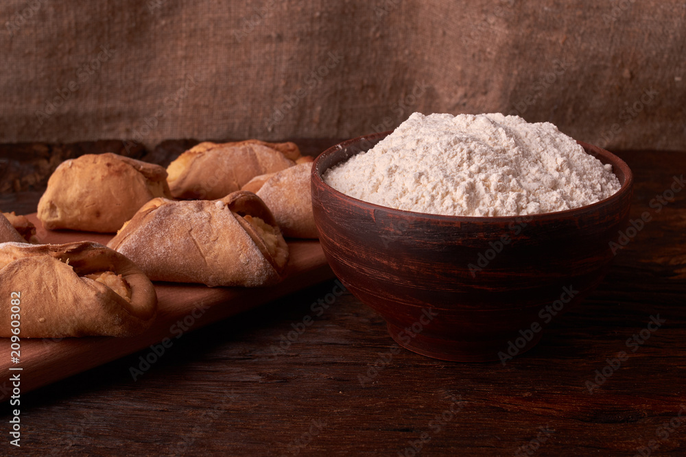 Fototapeta premium Close up Flour bread and whole grain , rolling pin and Cottage cheese cookies. Concept of homemade food