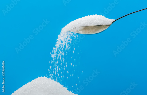Pouring sugar on a pile of sugar