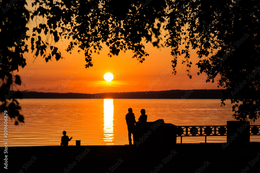 Silhouette of a couple in love at sunset or sunrise Silhouette of a couple in love at sunset or sunrise