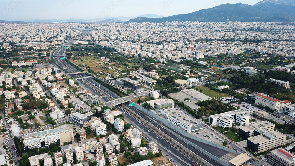Aerial drone bird's eye view of popular highway of Attiki Odos multilevel junction ring road, passing through Kifisias Avenue in Marousi