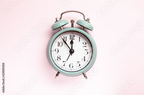 Wallpaper Mural Retro style alarm clock over the pastel pink background Torontodigital.ca