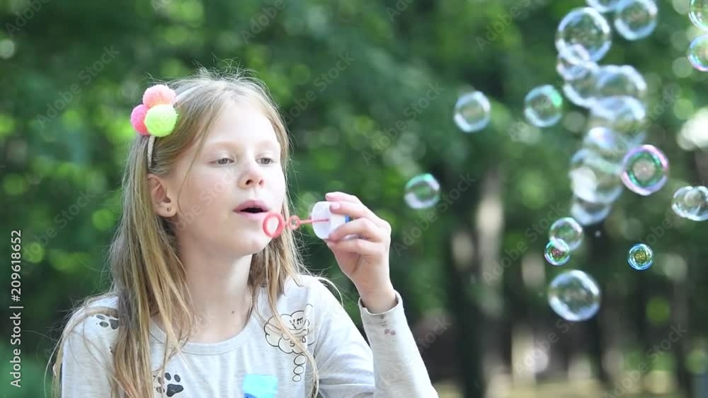summer fun. Girl with soap bubble. slow motion summer fun. Girl with soap bubble. slow motion