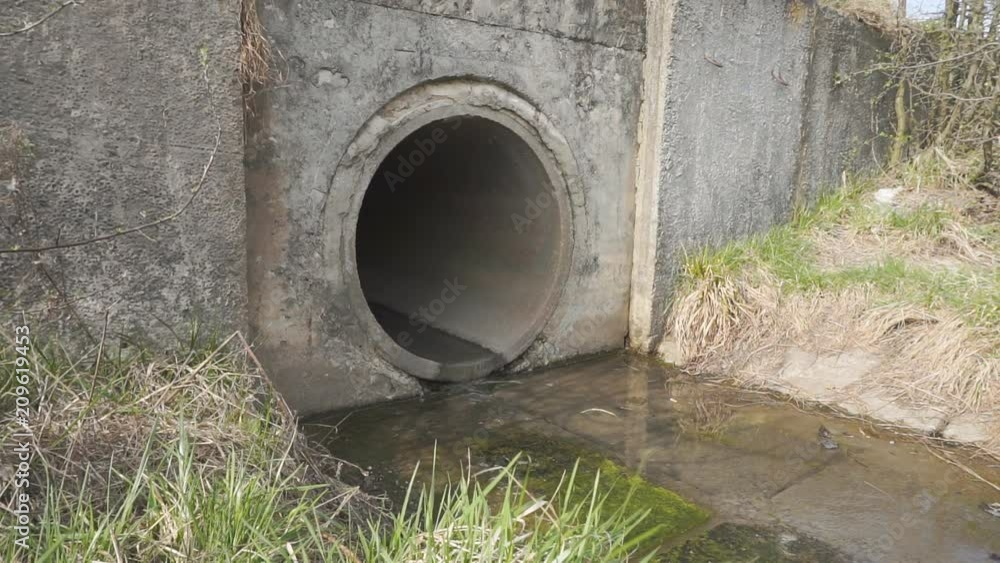 Waste water canal. The flow of water spilling from the pipe