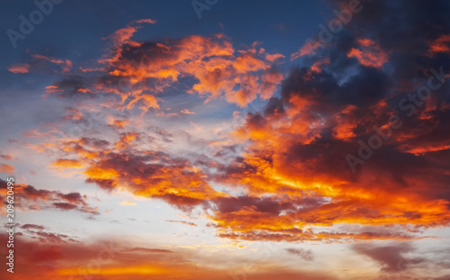 Fototapeta Naklejka Na Ścianę i Meble -  Fiery, orange and red colors sunset sky. Beautiful background