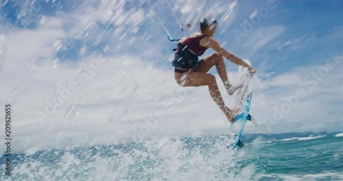 Beautiful young woman surfing, extreme sport slow motion