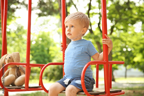 Cute little boy playing on ...