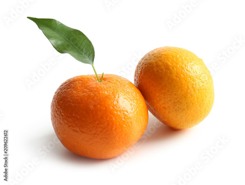 Ripe tangerines on white background