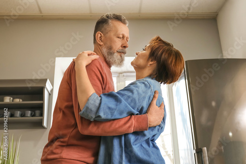 Happy mature couple dancing...