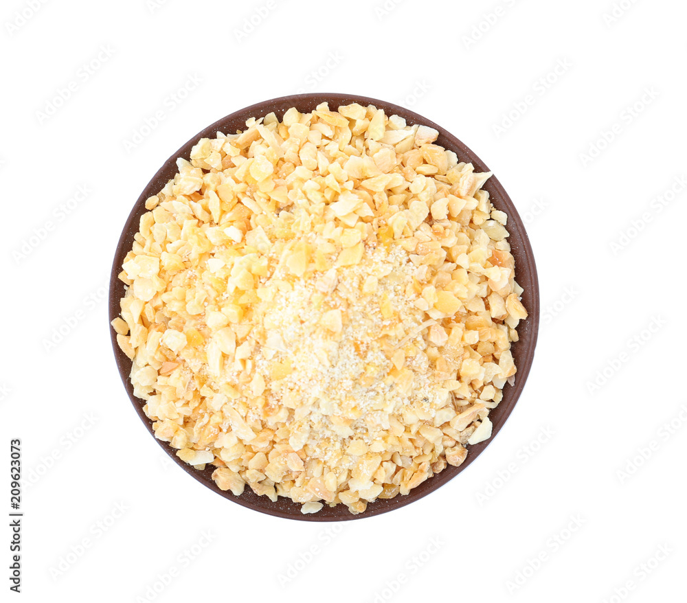 Bowl of granulated dry garlic on white background, top view Bowl of granulated dry garlic on white background, top view
