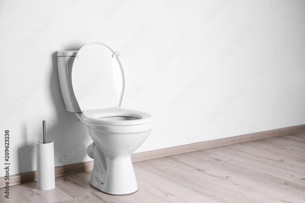 New ceramic toilet bowl in modern bathroom New ceramic toilet bowl in modern bathroom