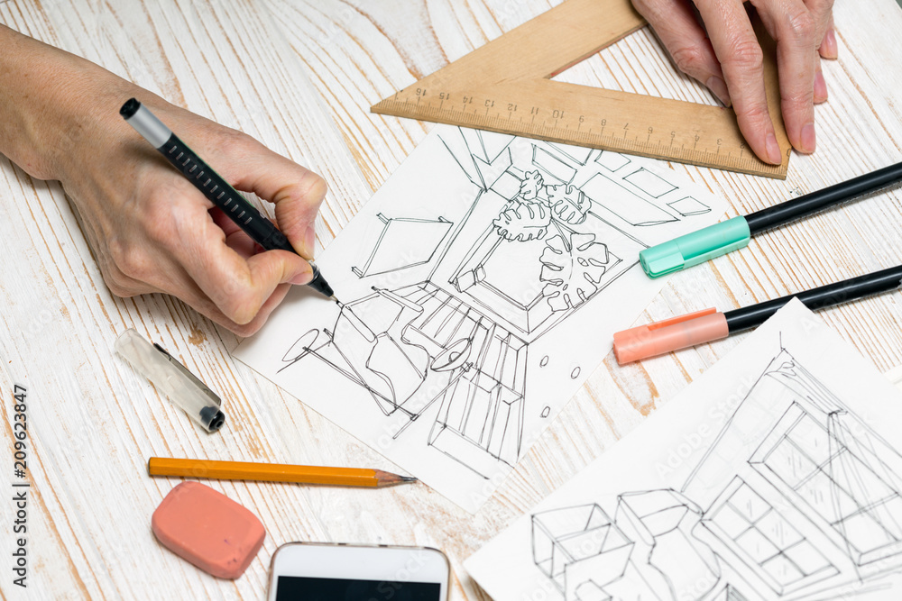 designer makes a sketch of the interior designer makes a sketch of the interior