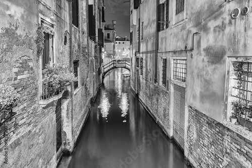 View over a picturesque canal at night, Venice, Italy