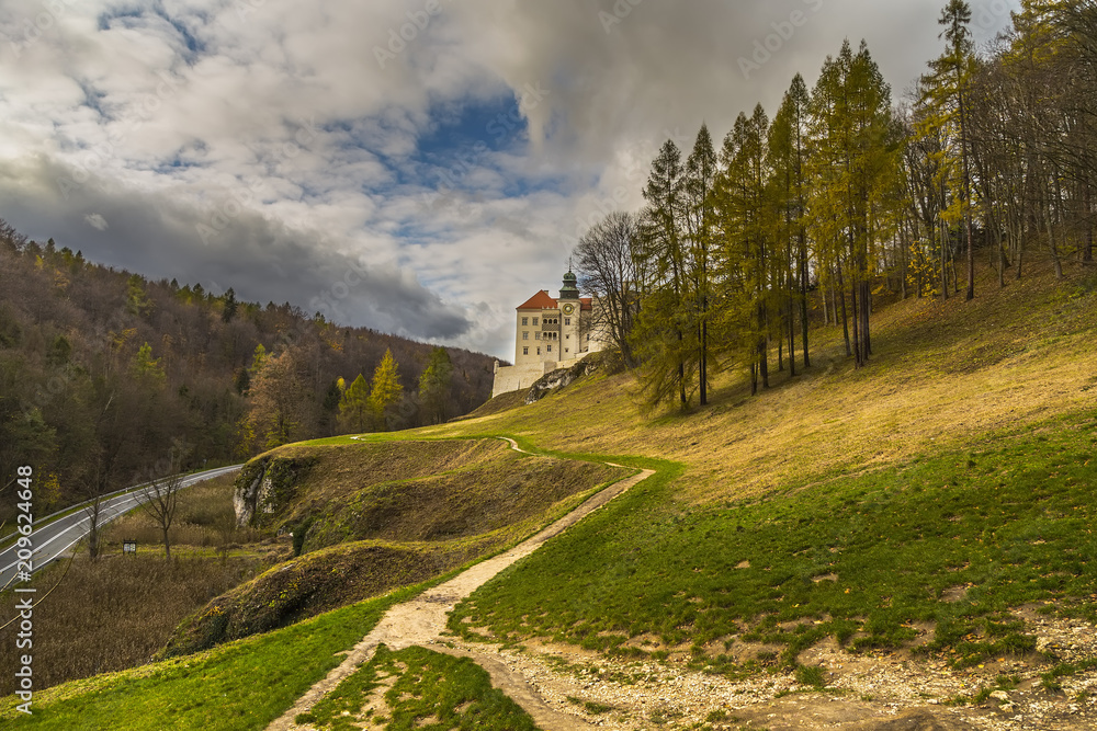 Landscape with autumn forest and a beautiful castle