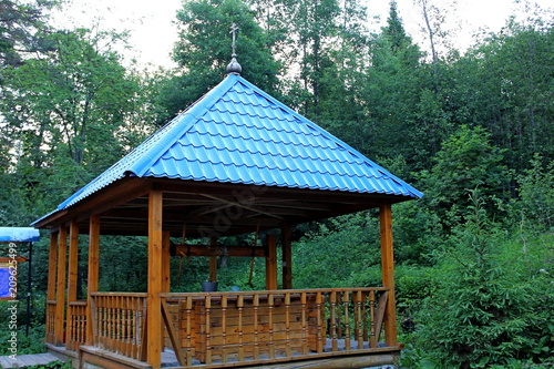 Wooden structure. on the site of the holy spring, on the site of historical events. Place of pilgrimage.