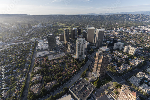 Aerial view of Century City towers with the Santa Monica Mountains in background in scenic Los Angeles California.