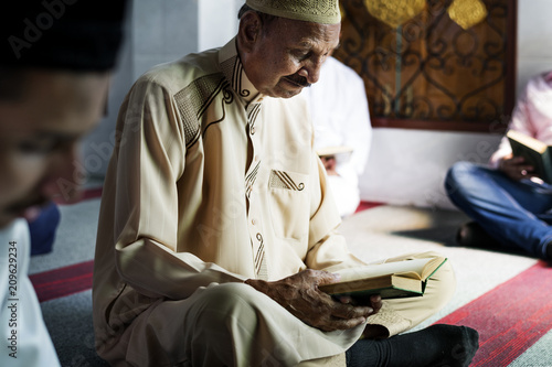 Photography Muslim men reading Quran during Ramadan
