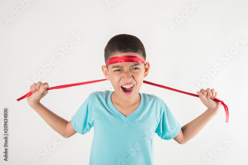 Boy tie a bow on his head intend to cheering up for sport