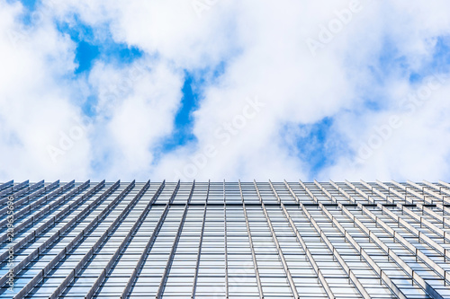 Asia Business concept for real estate and corporate construction - looking up view of panoramic modern city skyline with blue sky in tokyo, japan