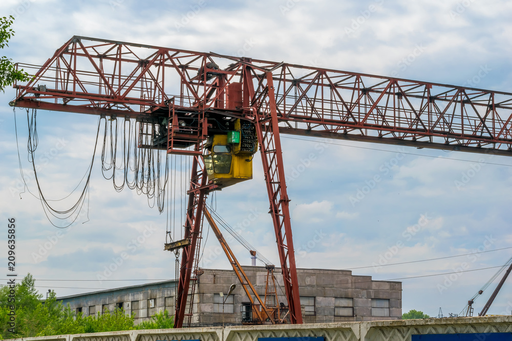powerful large industrial crane and cloudy weather