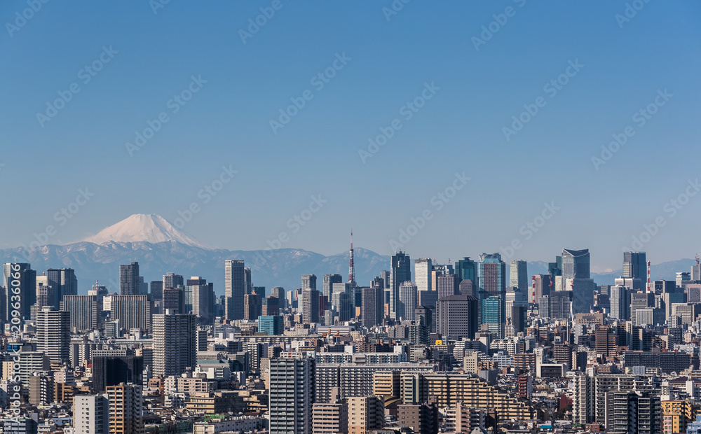 Tokyo city view , Tokyo downtown building and Tokyo tower landmark with Mountain Fuji on a clear day. Tokyo Metropolis is the capital of Japan and one of its 47 prefectures.