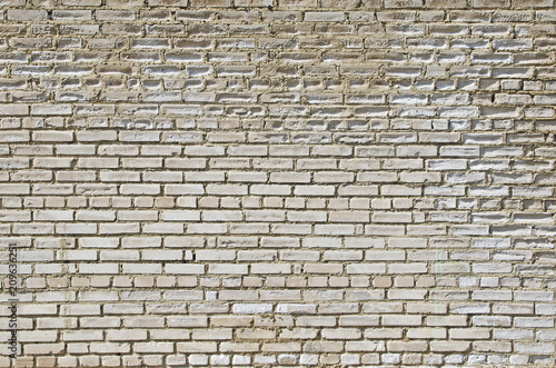 The wall of white silicate brick, which is destroyed by the impact of the fungus and the impact of the environment
