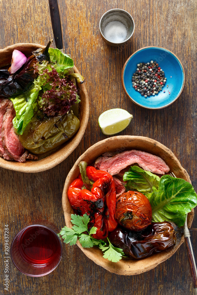 Top view grilled steak grilled vegetables served bread plate