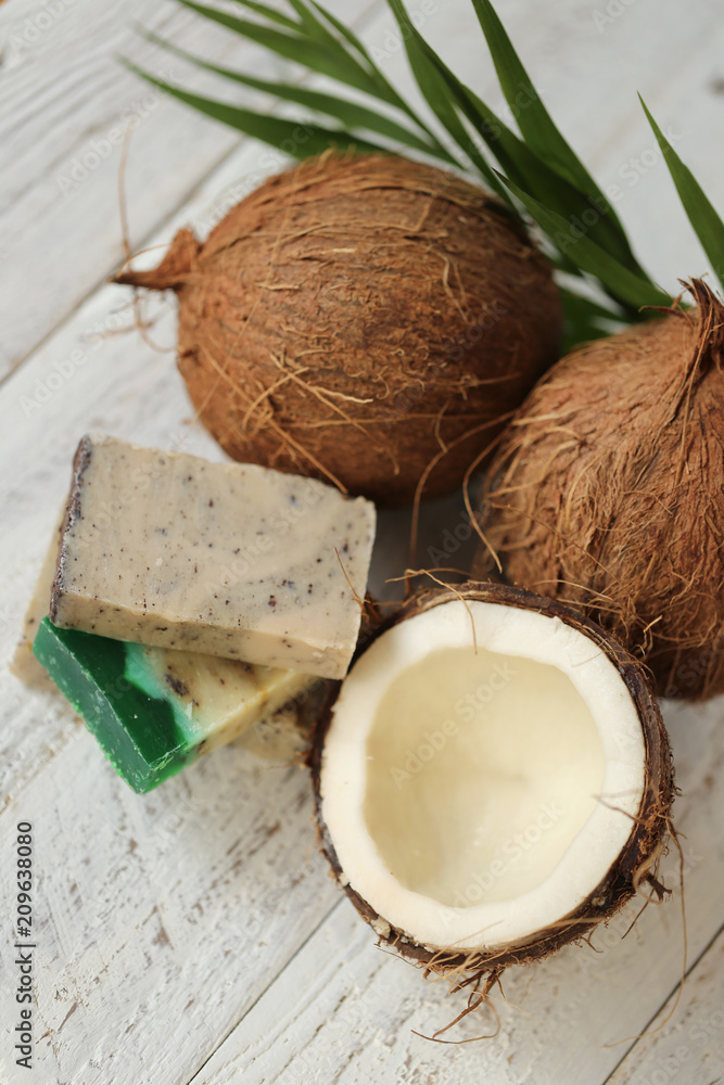 Coconut natural organic handmade soap. soap with coconut extract.soap with coconut oil  and fresh coconut in a cut on a shabby wooden background. Organic Cosmetics