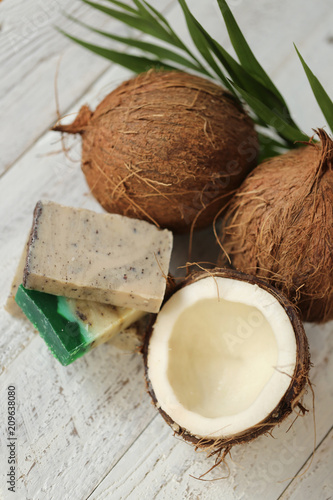 Coconut natural organic handmade soap. soap with coconut extract.soap with coconut oil and fresh coconut in a cut on a shabby wooden background. Organic Cosmetics